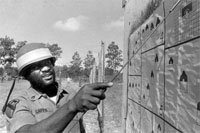 Then- Staff Sgt. Leon E. Caffie points to a hit during Army Reserve training in Florida in the 1970s